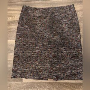 Tahari pencil skirt.  Size: 12.  Small slit on back. Metallic thread throughout.